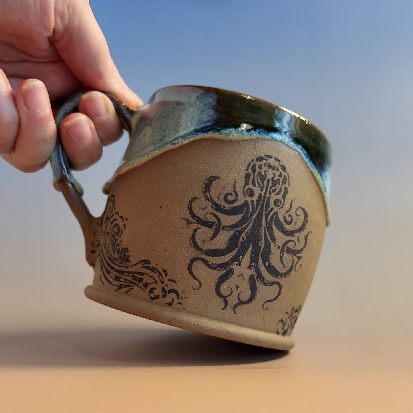 Divine Vessels Pottery - Octopus mug coastal design with wave glaze and sandy texture