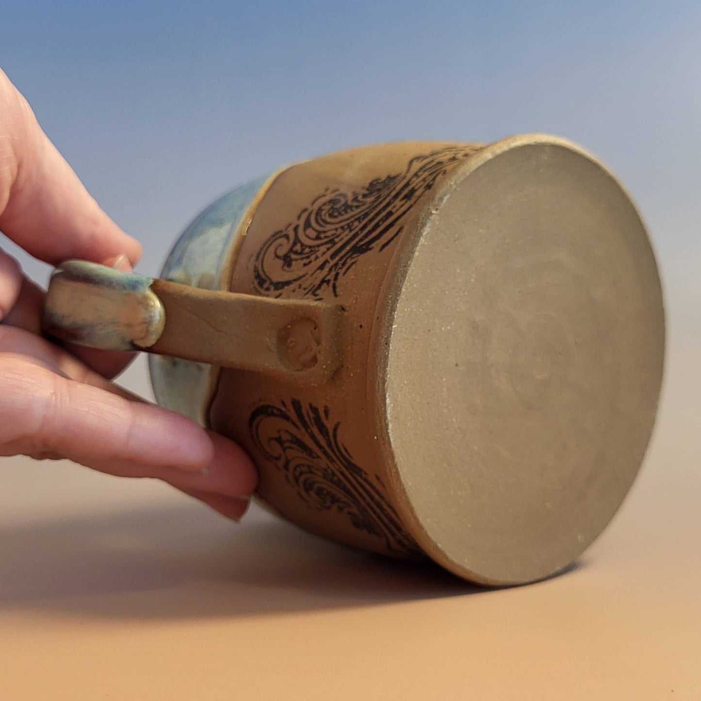 Divine Vessels Pottery - Octopus mug coastal design with wave glaze and sandy texture