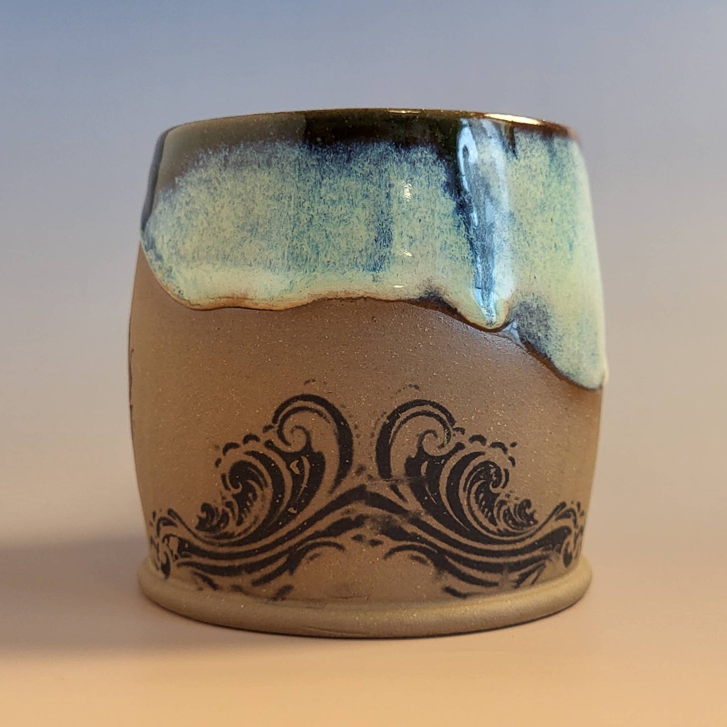 Divine Vessels Pottery - Octopus mug coastal design with wave glaze and sandy texture