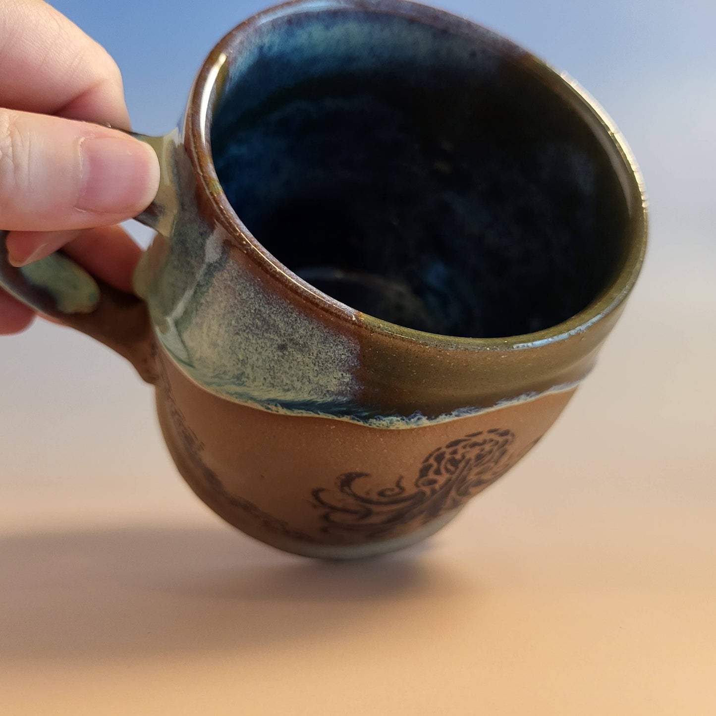Divine Vessels Pottery - Octopus mug coastal design with wave glaze and sandy texture